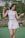 women's white sleeveless top and white skirt
