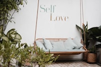 brown rattan swing bench with cushions
