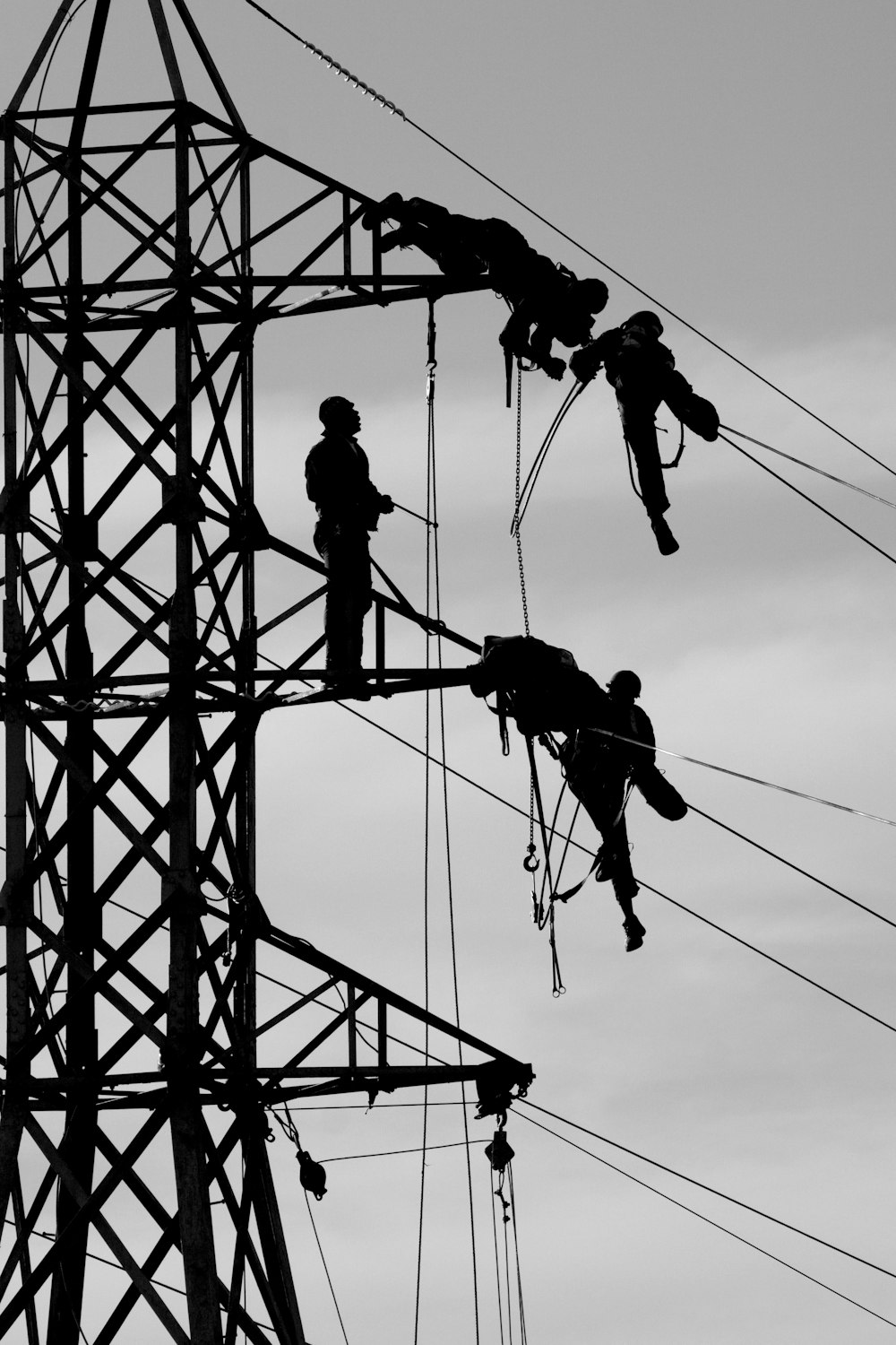 man fixing the transmission tower