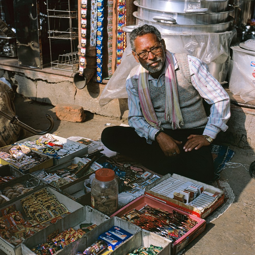 man seilling items on sidewalk