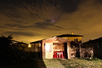Evening shot of a 20ft shed illuminated by warm outdoor lighting, highlighting its clean lines.