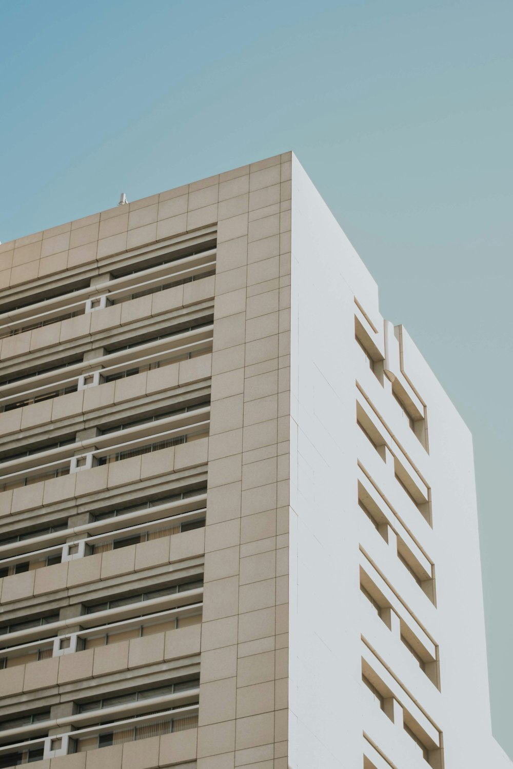 a tall building with a sky in the background