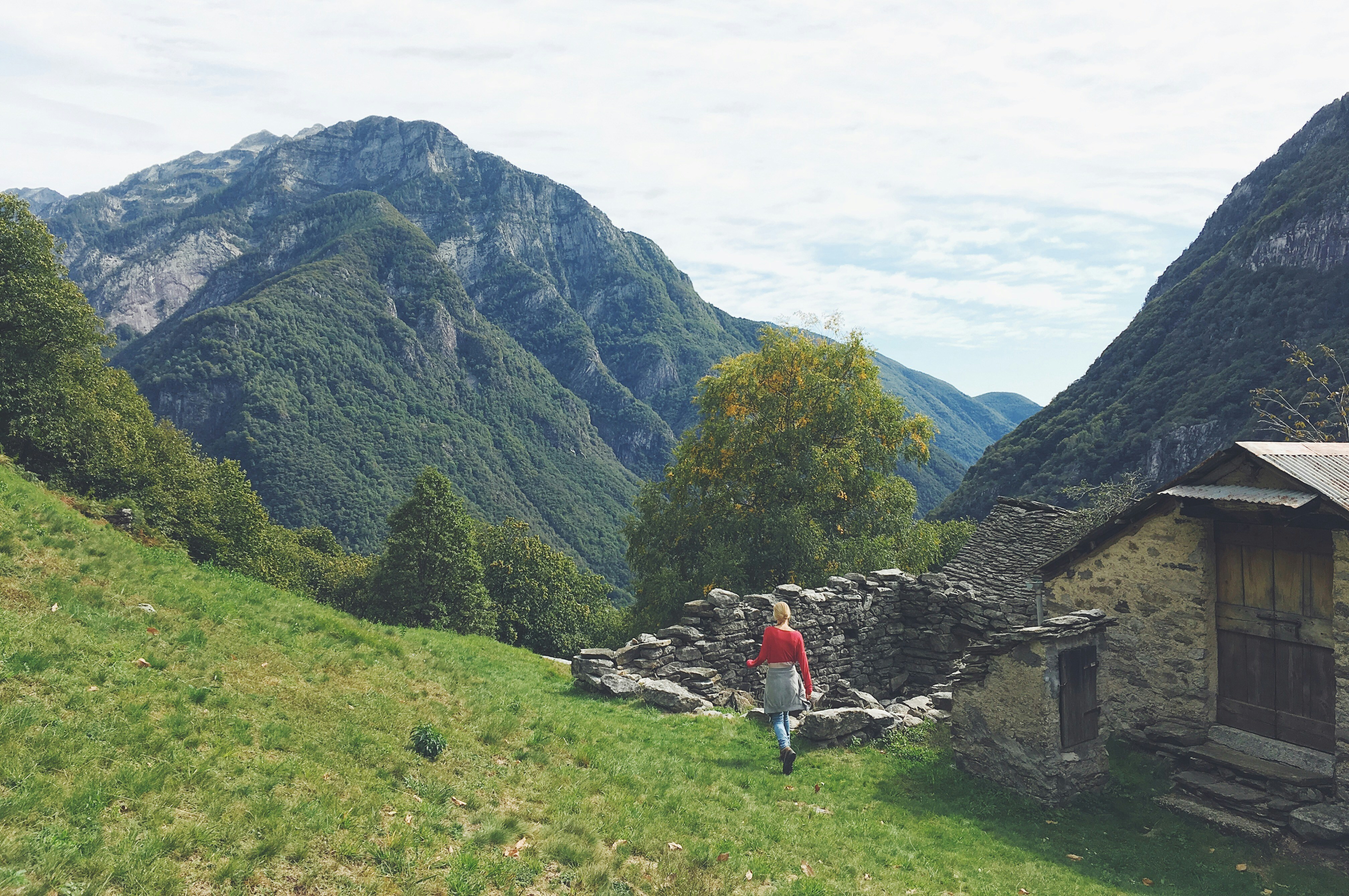 house and mountains under white sky