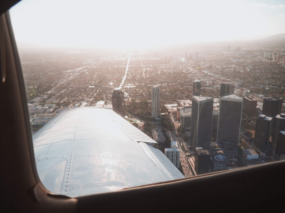 gray airplane flying during daytie