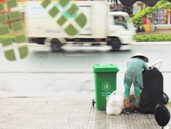 person scavenging on side of road