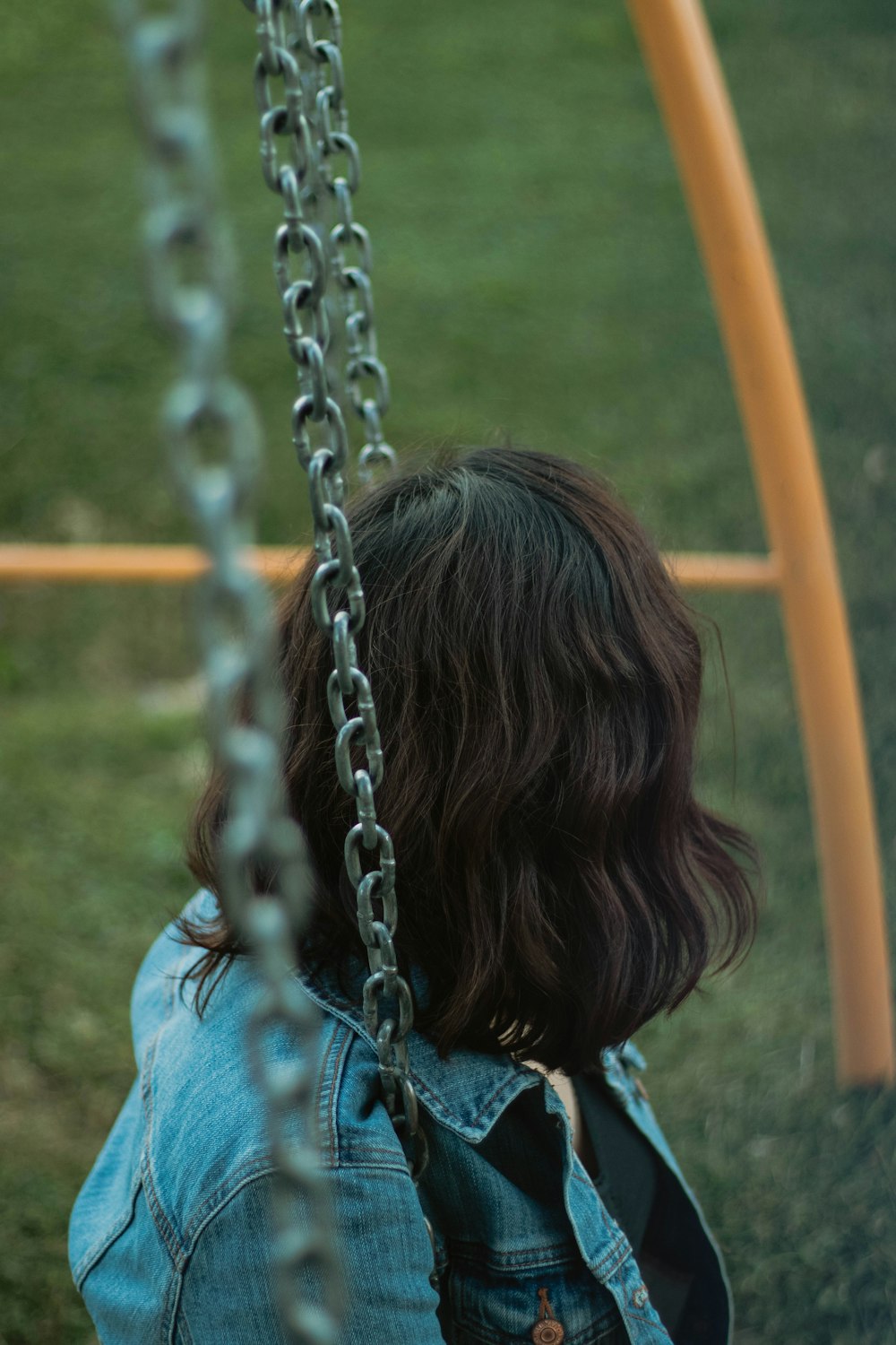 woman sitting on swing