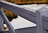Close-up of a clean wooden fence after a thorough pressure wash.