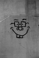 A pencil sketch of a friendly cartoon animal with big eyes and a wide smile.