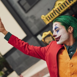 man wearing Joker face paint