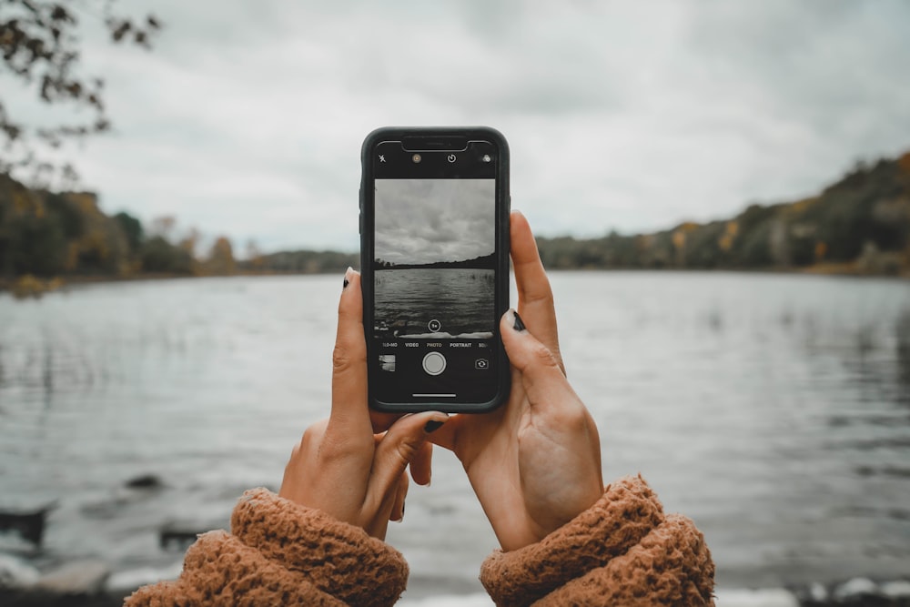 woman holding iPhone