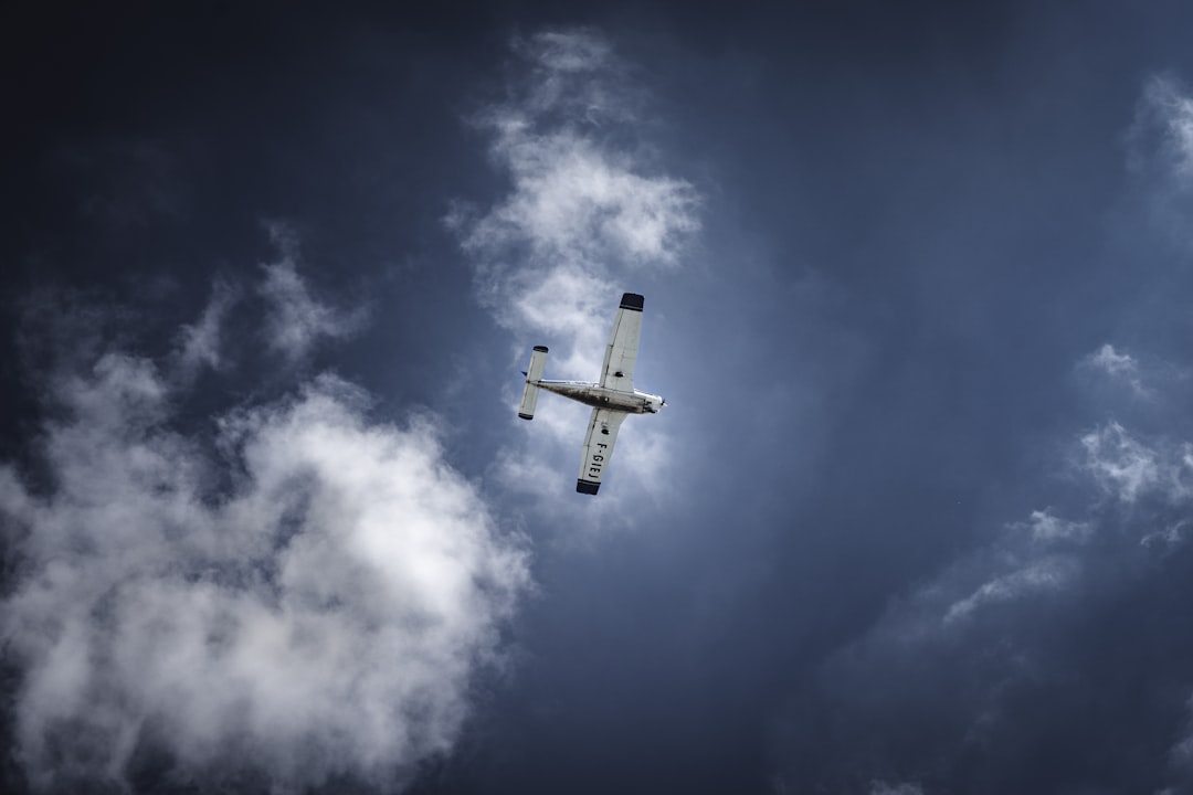 gray and black flying plane during daytime