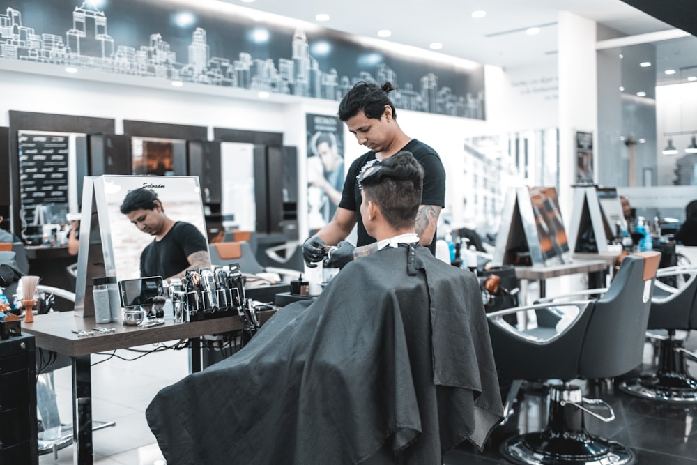 Shallow Focus Photo Of Man Getting A Haircut Photo Free Person
