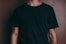 man wearing black crew-neck t-shirt