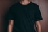 man wearing black crew-neck t-shirt