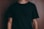 man wearing black crew-neck t-shirt