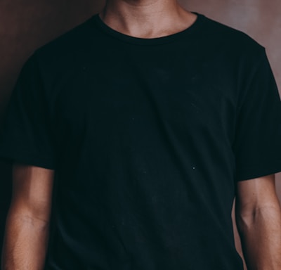 man wearing black crew-neck t-shirt