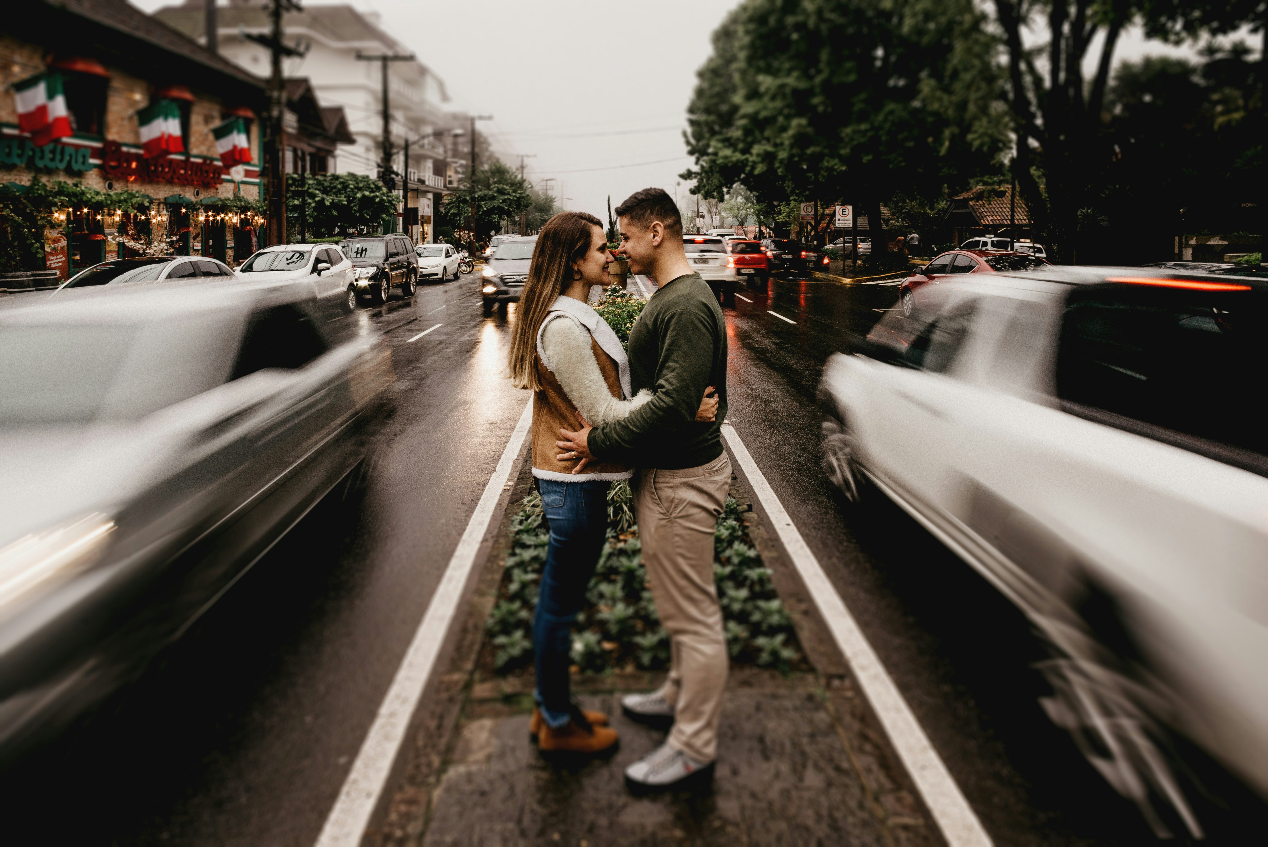 couple standing in middle of road
