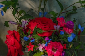 A vibrant bouquet of flowers against a beach backdrop.