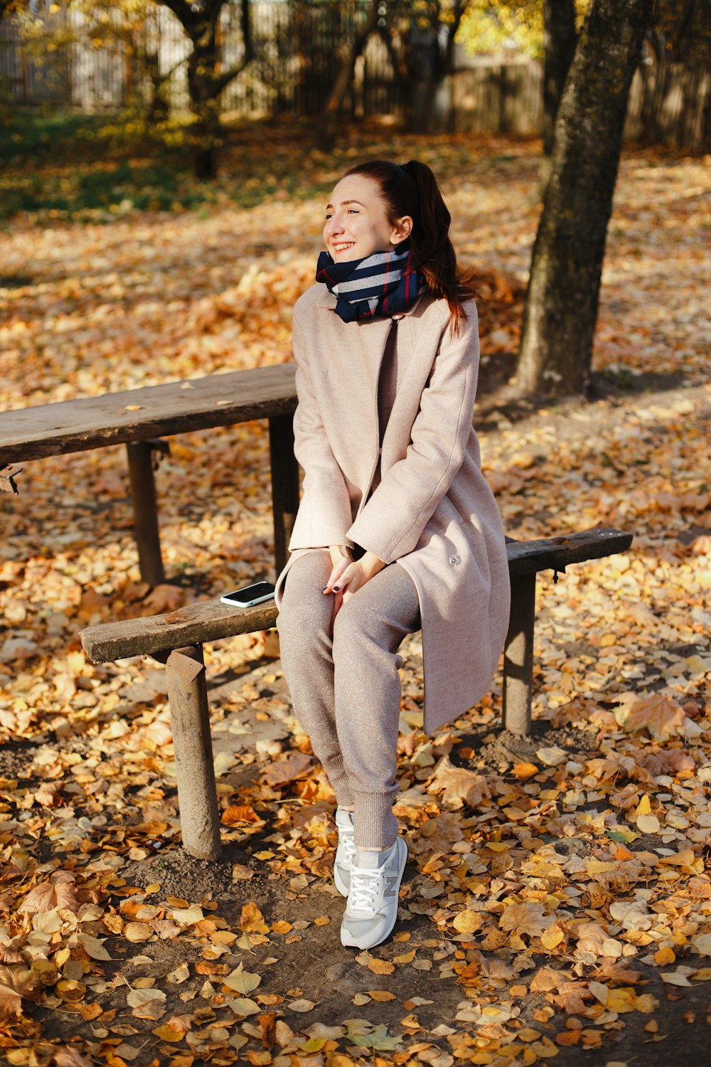 woman wears brown coat