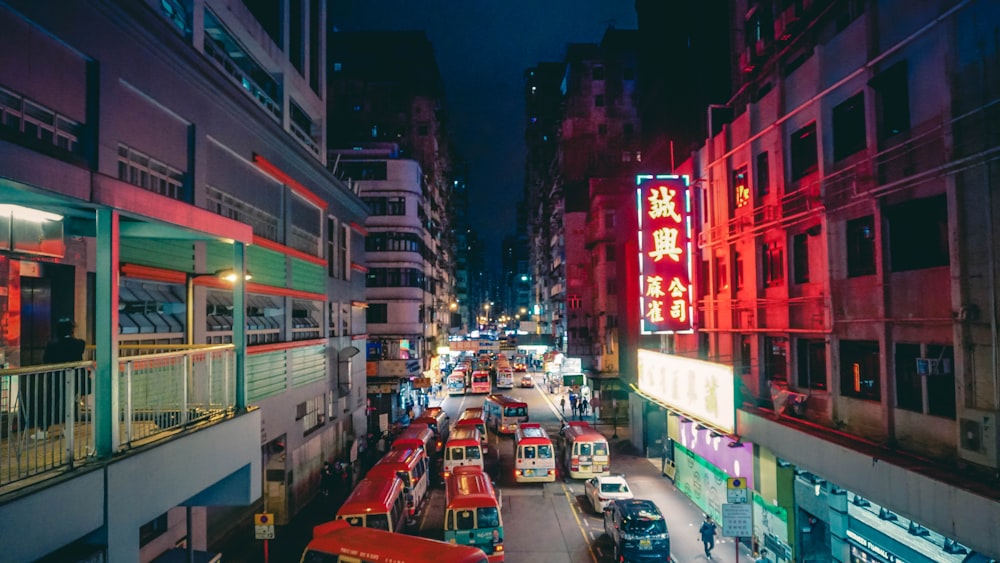 vehicle passing between buildings at night