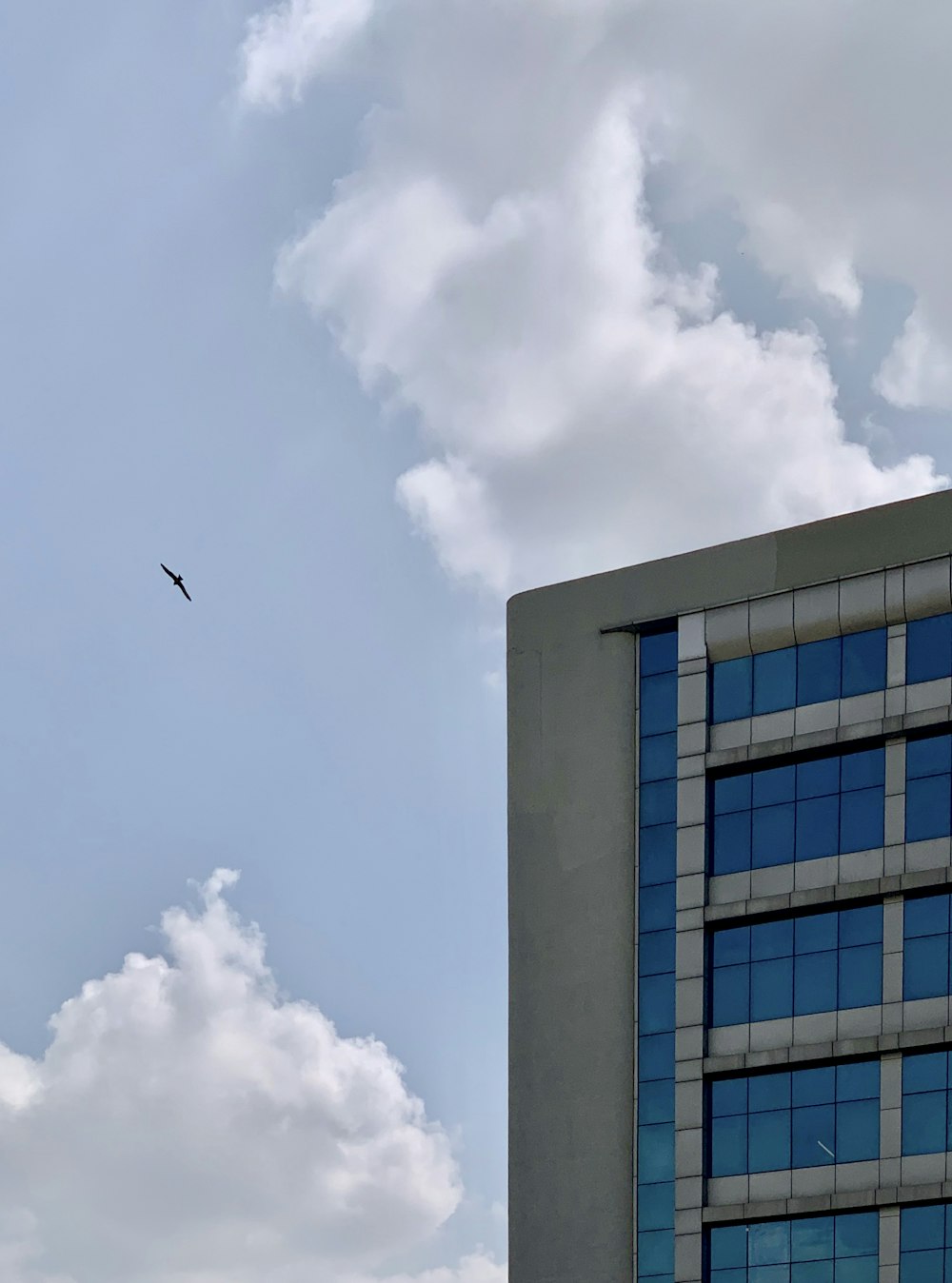 grey and blue high-rise building