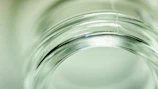 Artistic shot of open cream jar with smooth texture and soft lighting