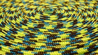 Close-up of a thick, braided Bharat Rope 7 Star brand rope coiled neatly.
