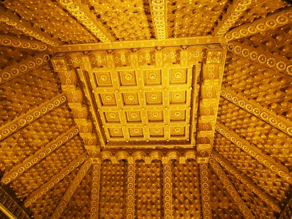 the ceiling of a building with intricate designs