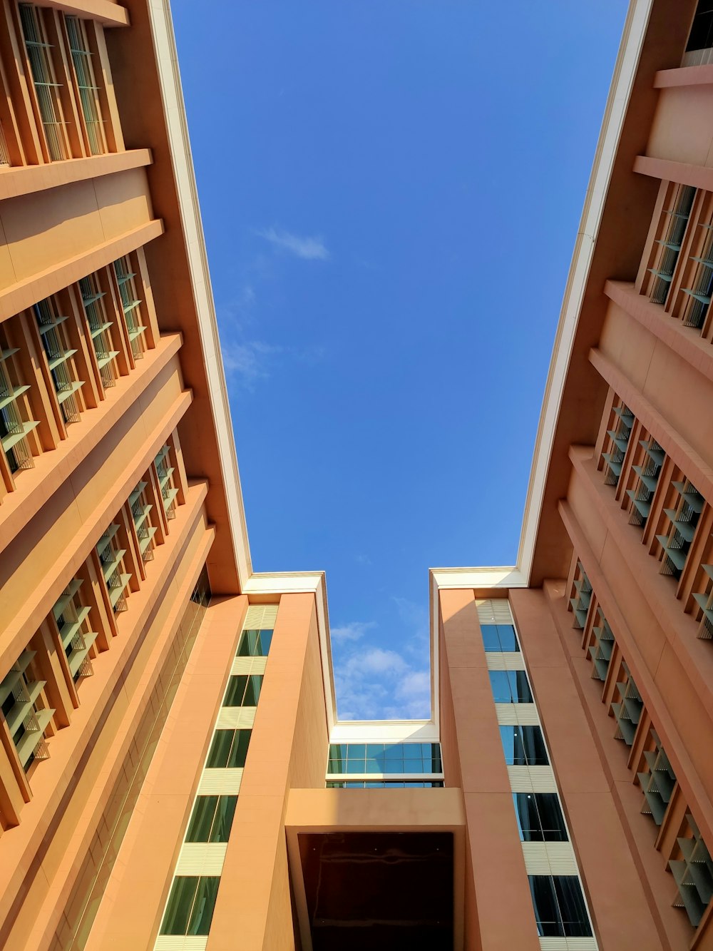 low-angle photography of orange buildings