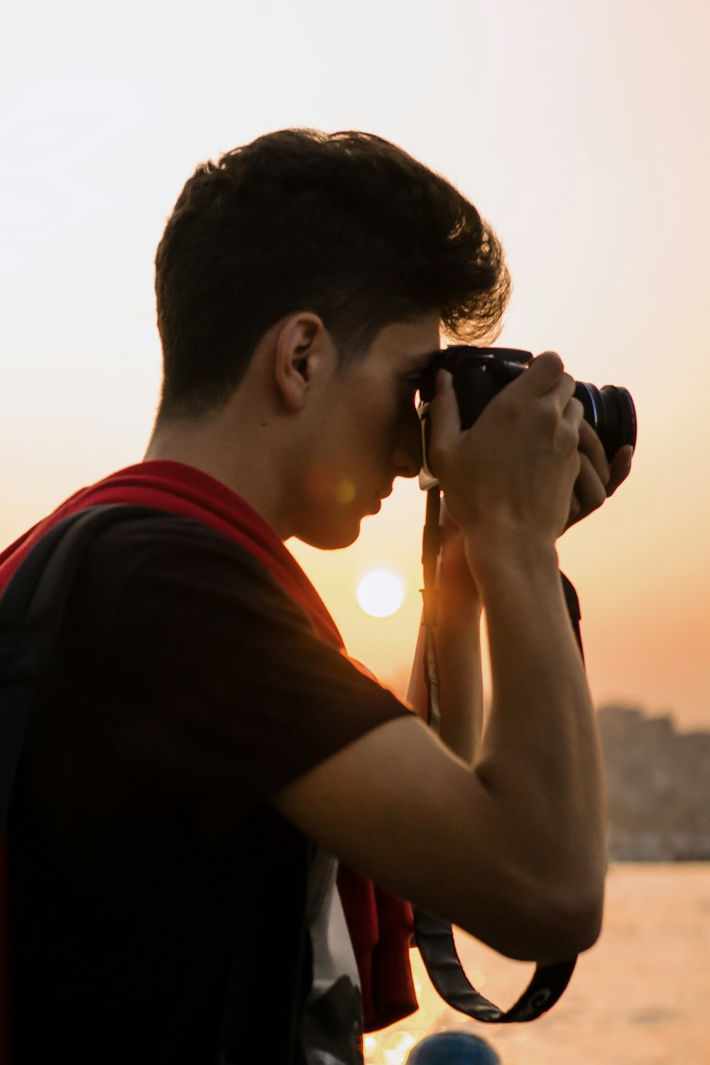 man holding DSLR camera