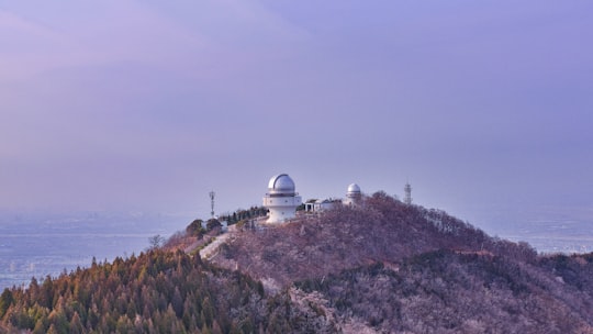 white dome building on top of hill in Li Shan China