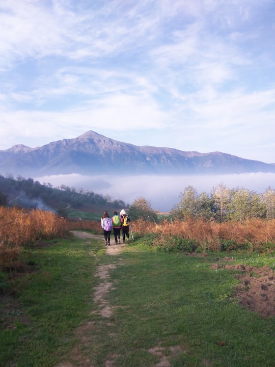 three people walking on wilderness in Masooleh Iran