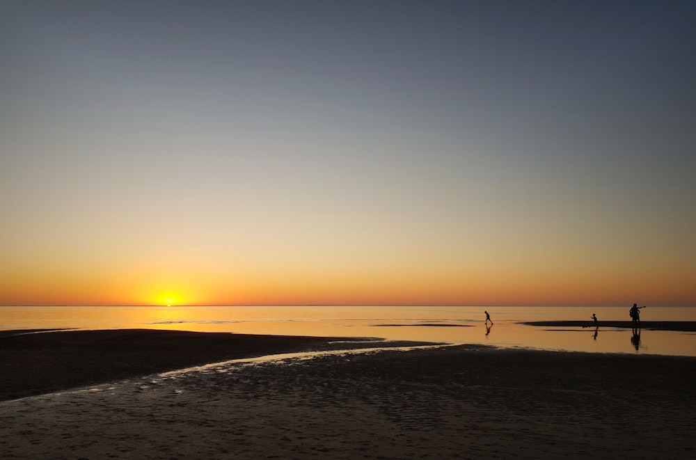 body of water at sunset