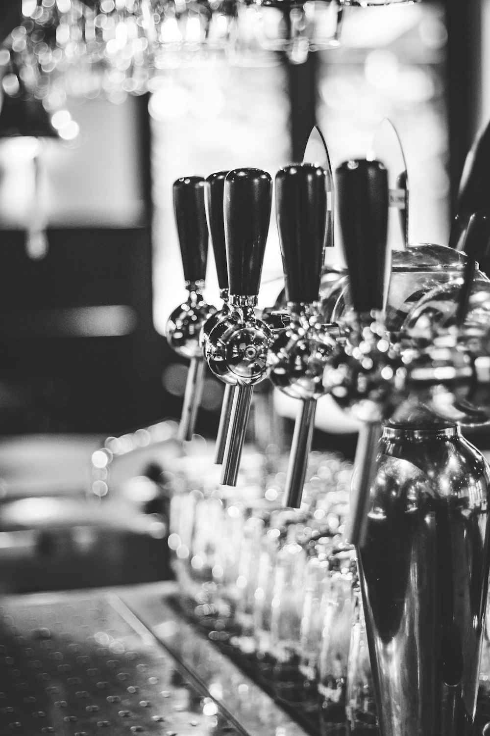 grayscale photography of beer tap handle