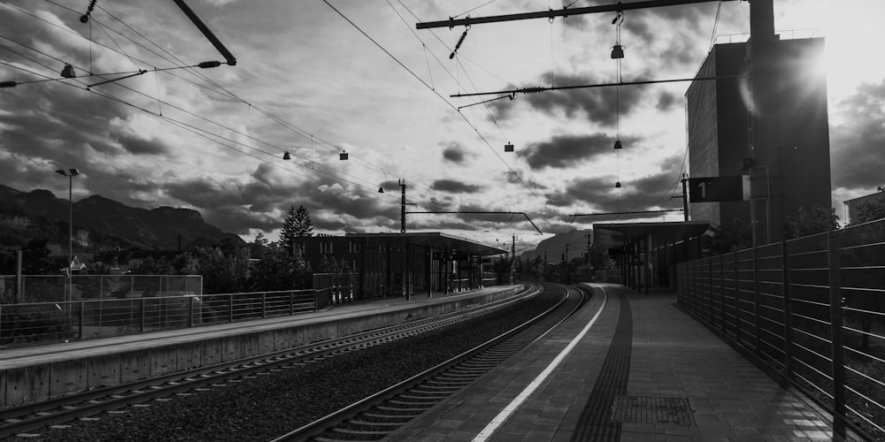 a black and white photo of a train track