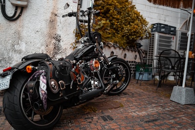 A set of durable, waterproof saddlebags attached to an electric motorbike.