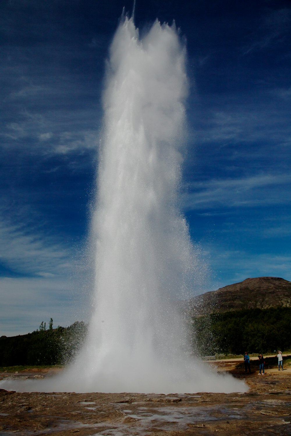 geyser under blue sky