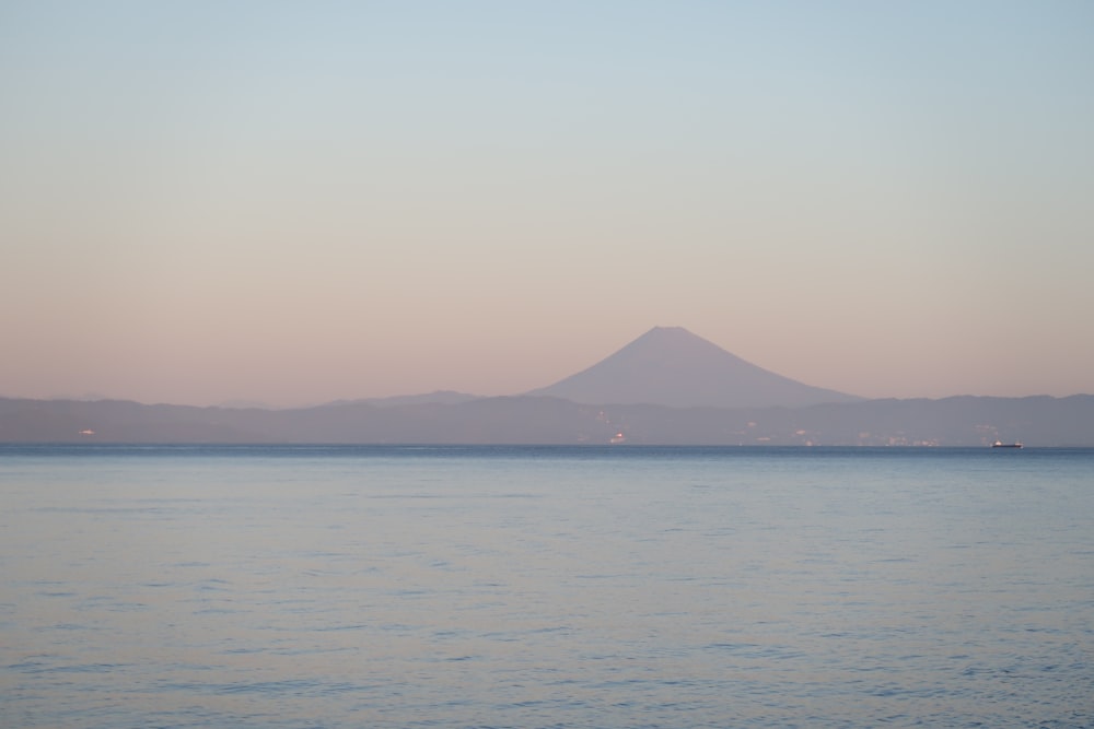 mountain facing b ody of water