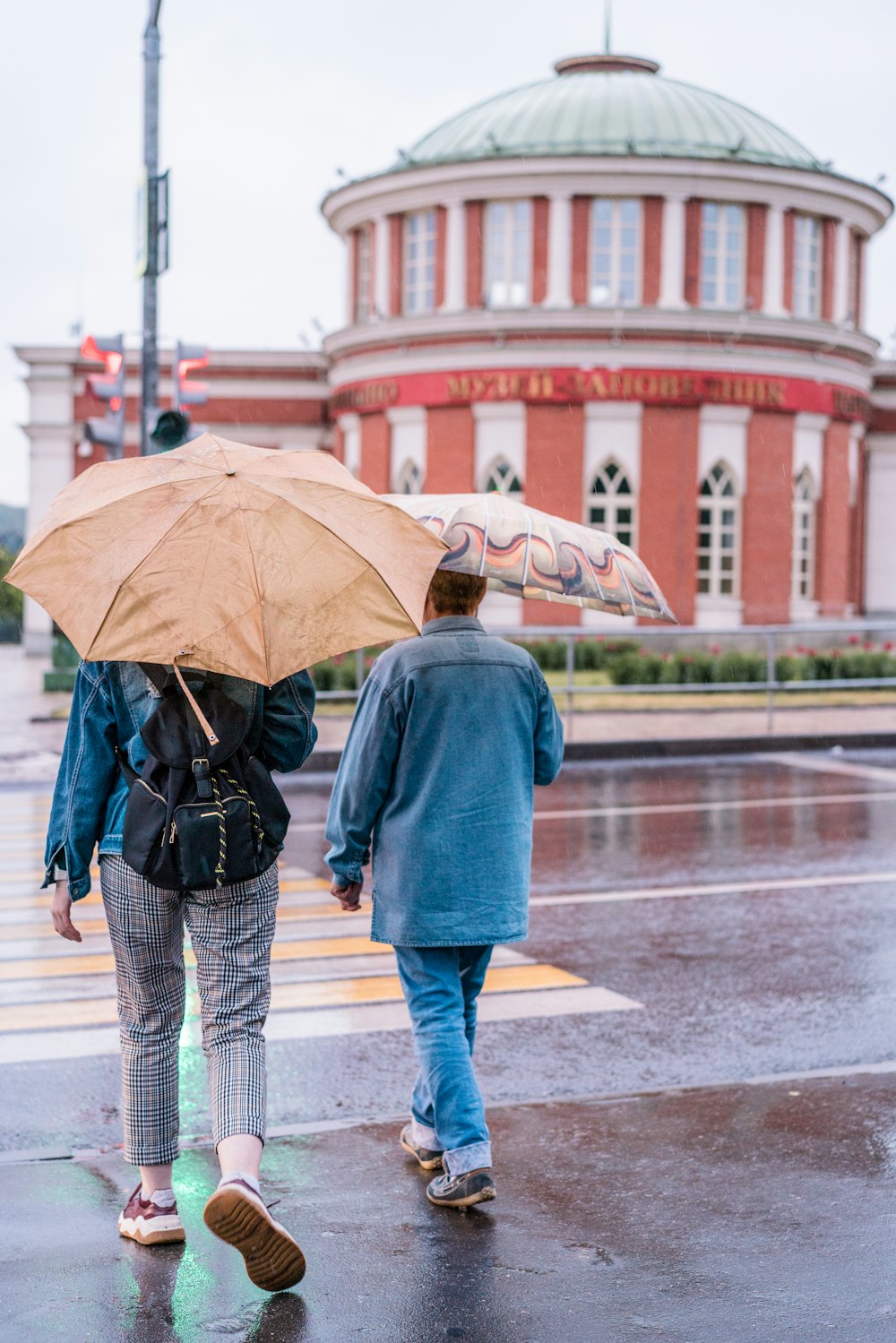 two persons walking on street