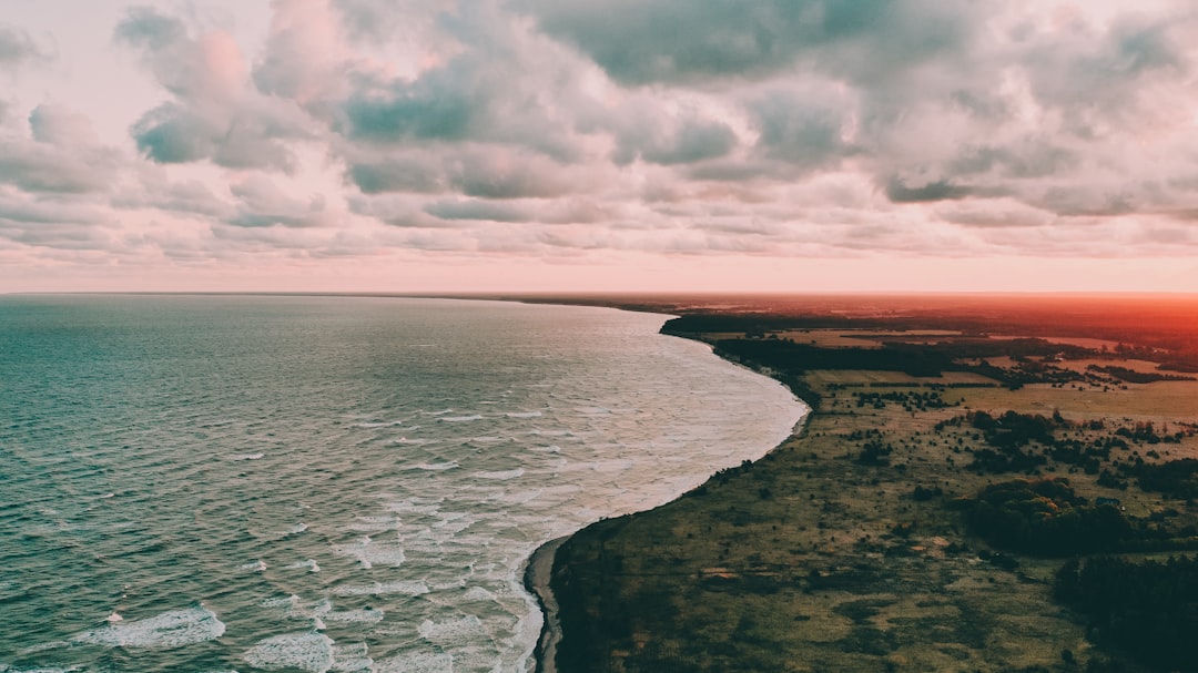 beach line under white cloud