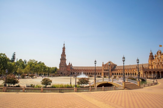 brown house beside monument in Plaza de España Spain