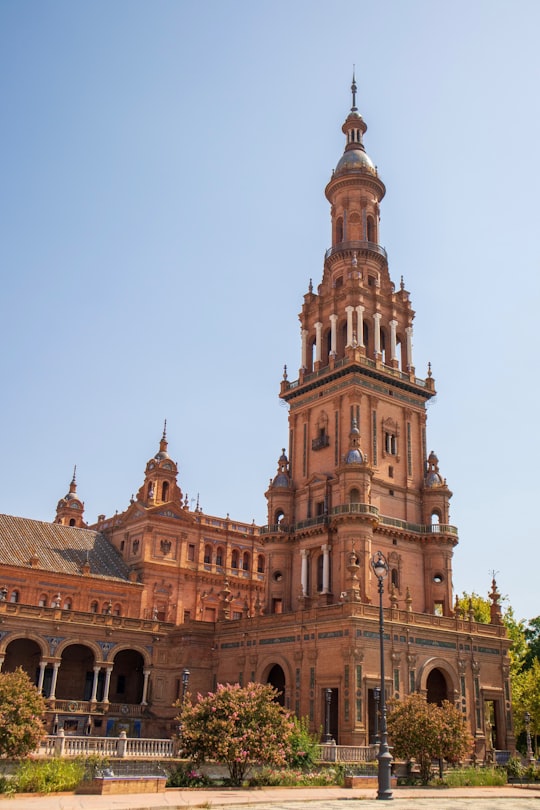 brown concrete structure with tower in Plaza de España Spain