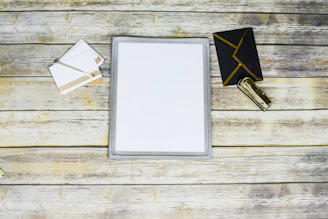 An elegant flat lay of the premium PDF guide on a slate gray desk with gold pen.