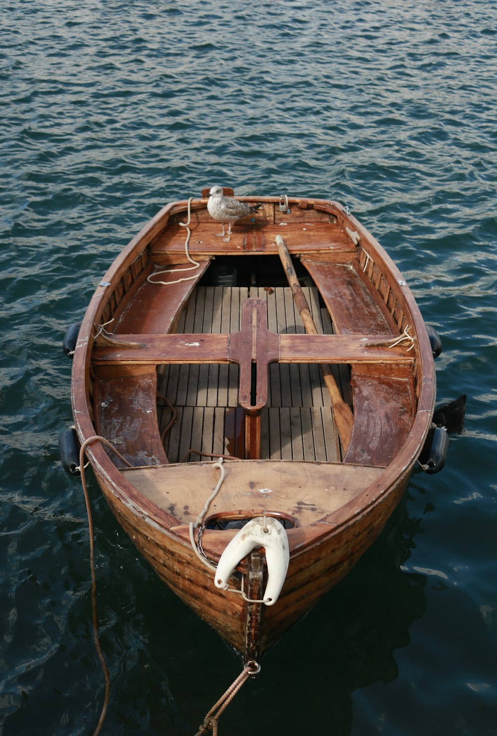 photo of brown wooden canoe boat