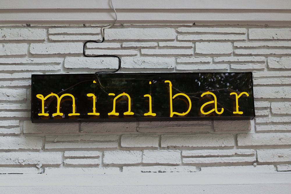 yellow and black LED Minibar signage