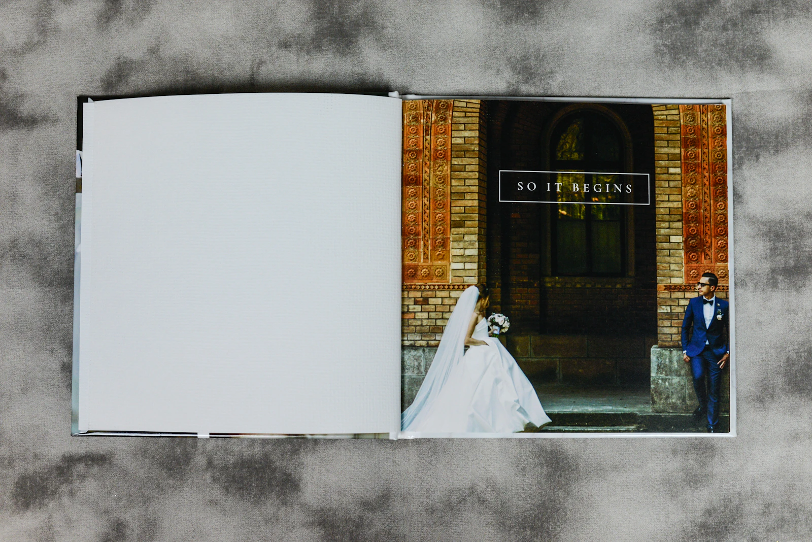 An heirloom album open across a table to a ceremony spread
