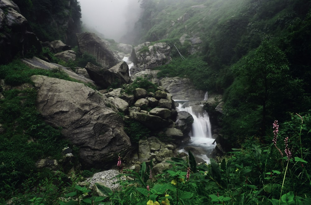 waterfall with big rocks beside