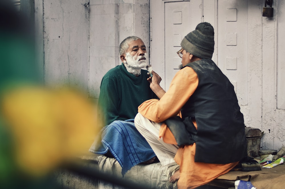 two men shaving