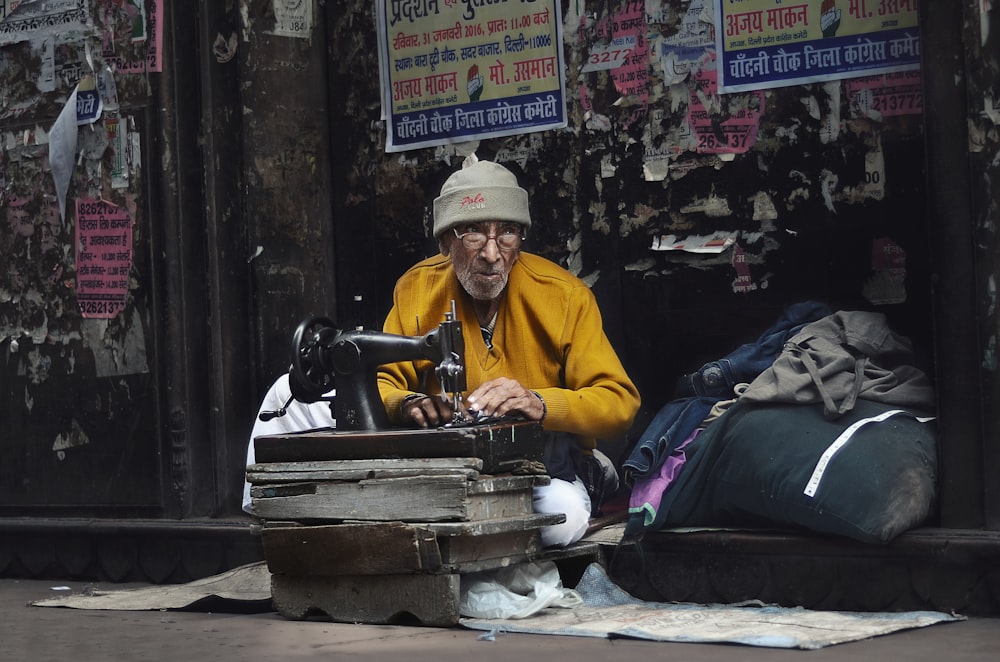 man sewing clothes