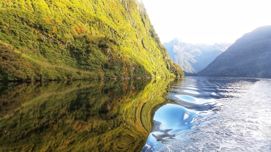 hills beside lake in Doubtful Sound New Zealand